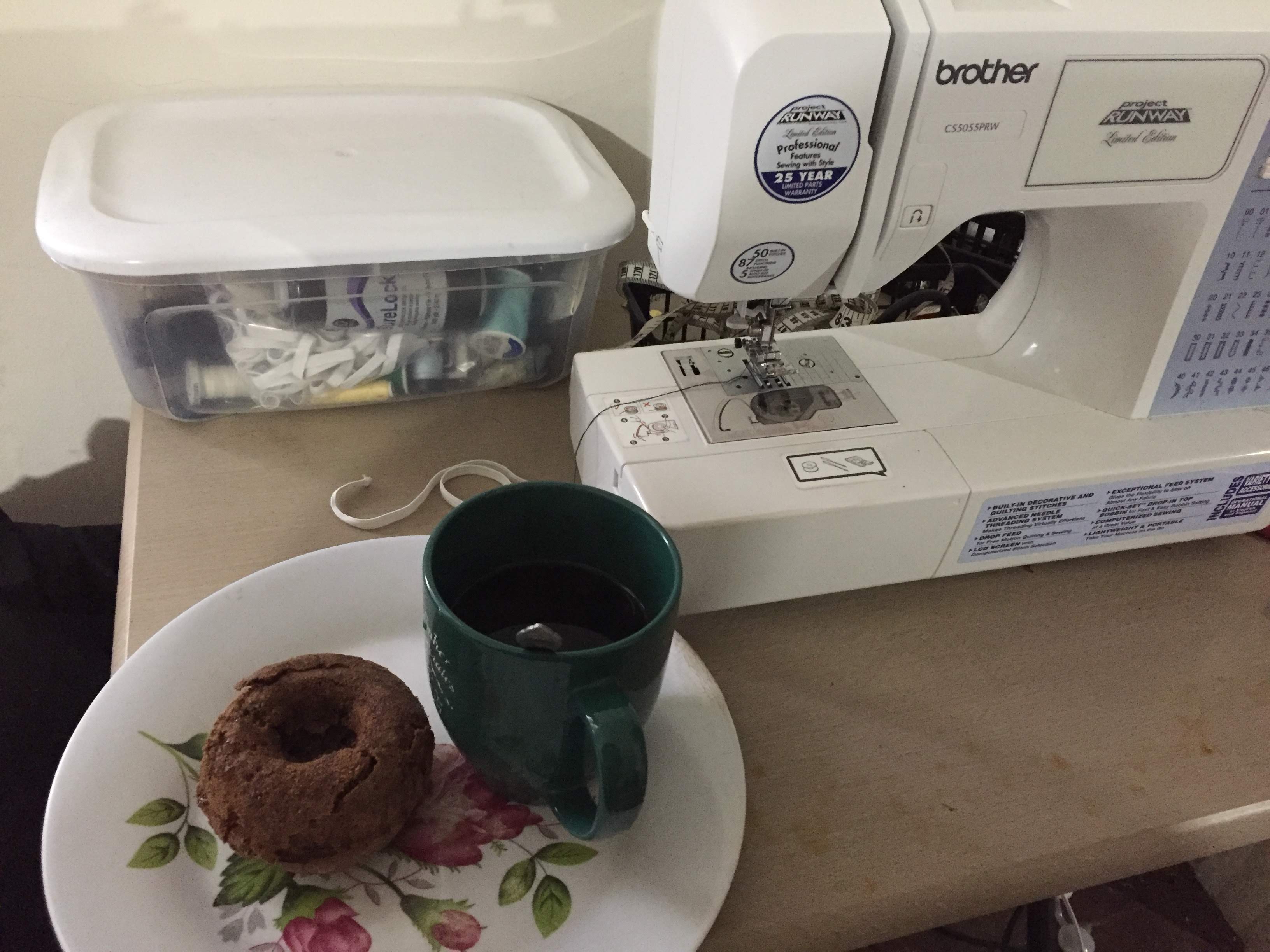 Sewing with a donut and coffee